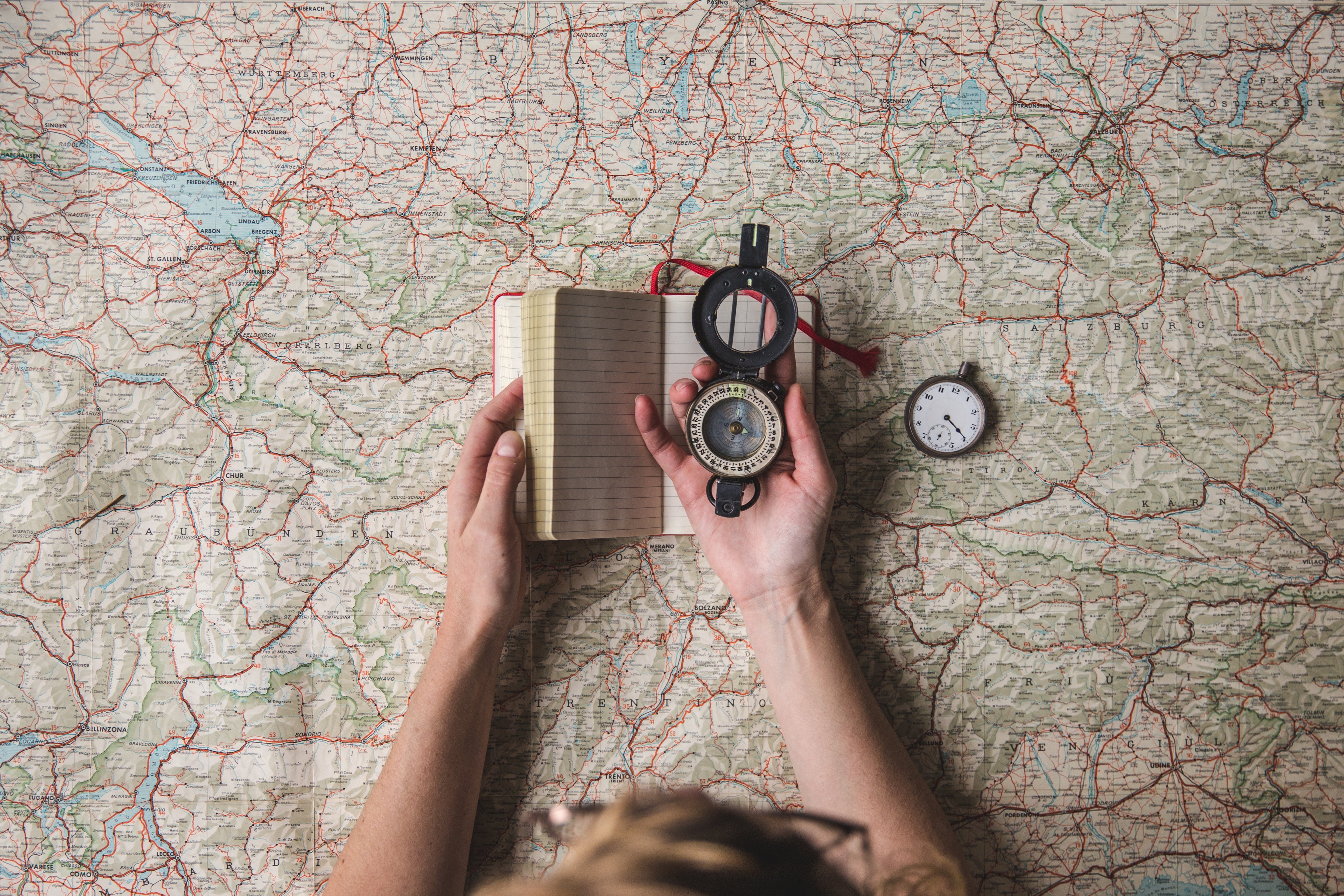 Planning a hike with map and compass